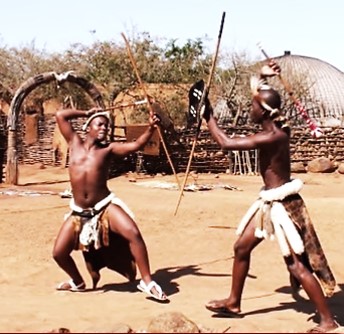 Young Xhosa men engaging in a traditional stick fighting contest. South  Africa 1960's-70's.
